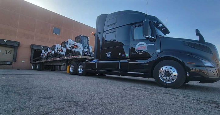 flatbed-trailer-with-three-bulldozers