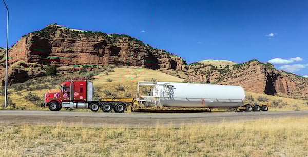A heavy haul truck in transit with an over-dimensional load.