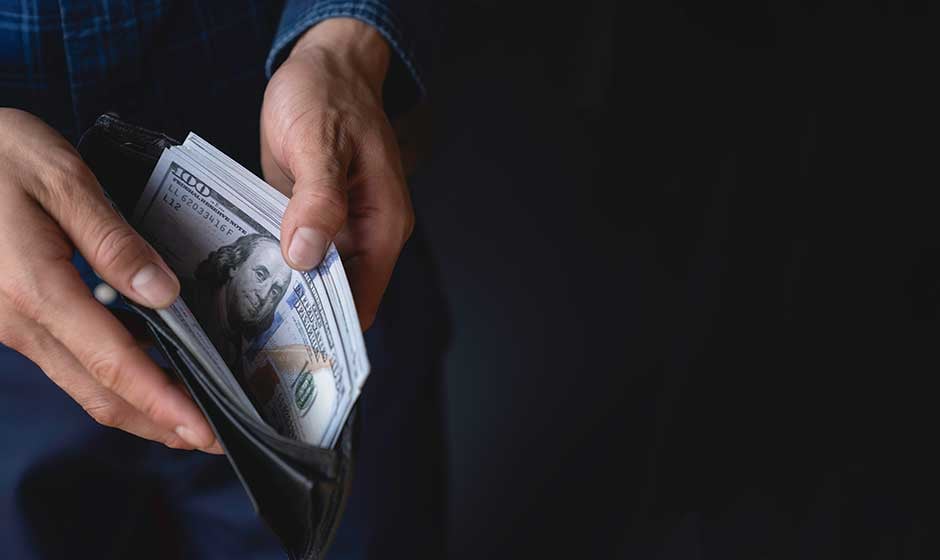 open-wallet-hundreds-in-back