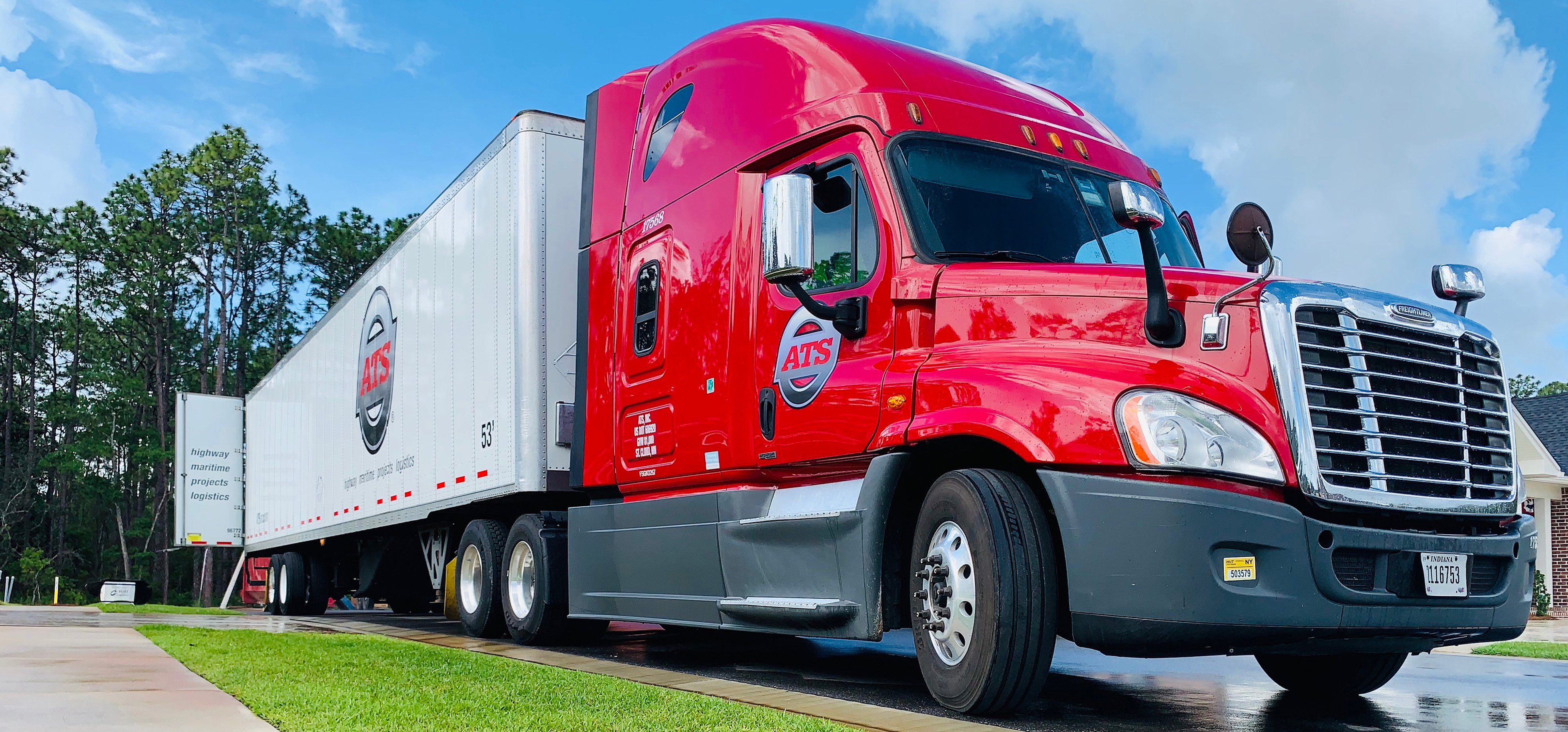 Red ATS dry van with door open