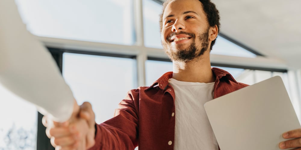 Smiling-Man-Shaking-Hand
