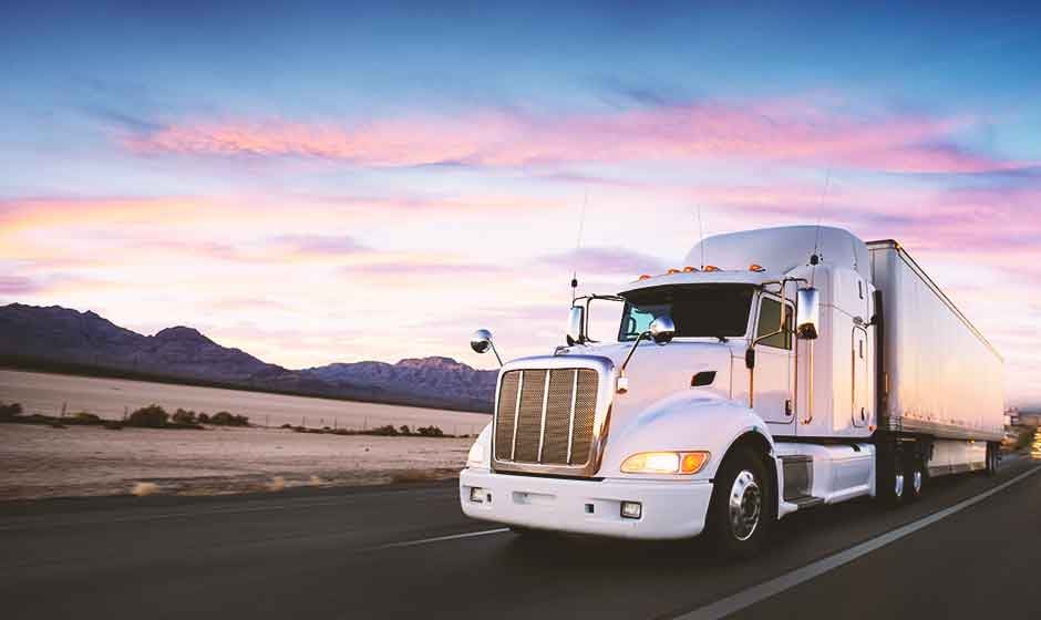 White dry van trailer highway driving