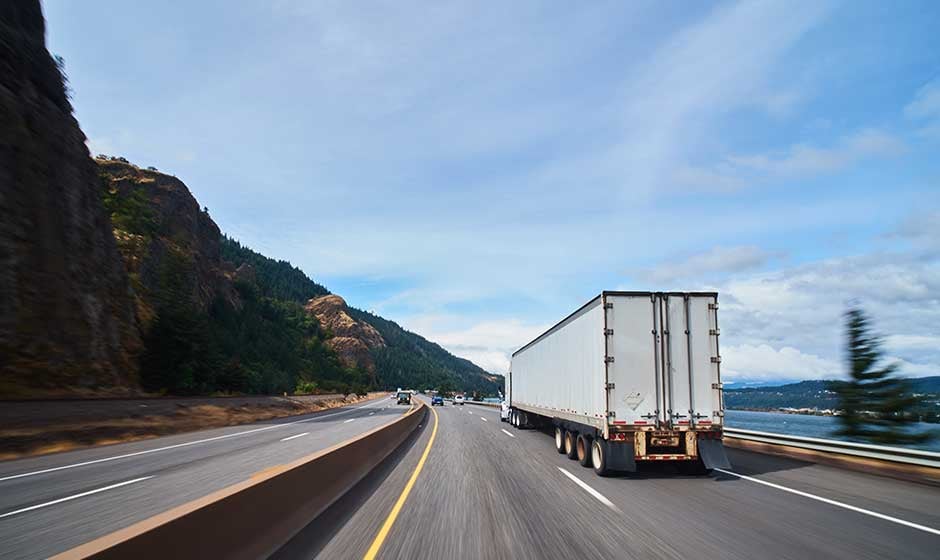 White Dry Van Trailer on Highway