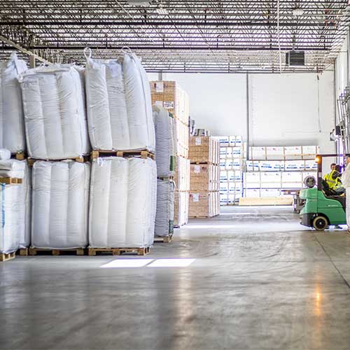 Bags of material on pallets at warehouse