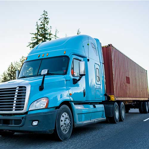 Blue truck with a container on chassis