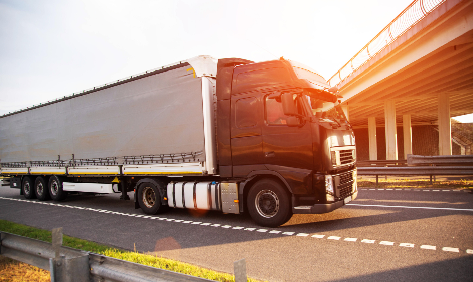 A truck with a Conestoga trailer