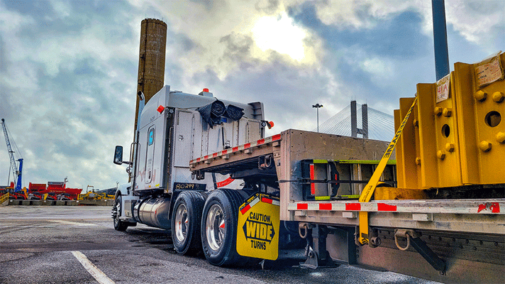 An open-deck trailer and truck