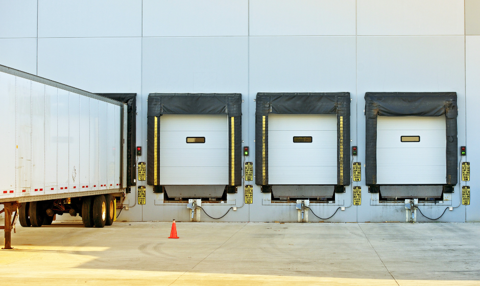 Trucks unloading at a warehouse