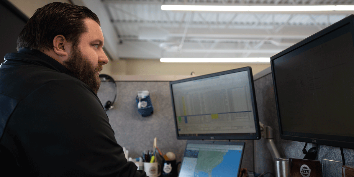 Man staring at his computer in concentration.