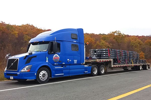 semi truck with step-deck trailer