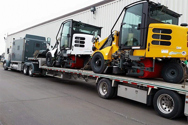 step deck trailer hauling construction freight