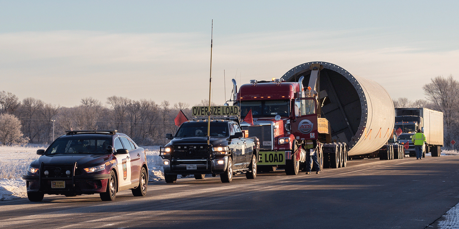 Minnesota State Patrol escort with pilot car escort in front of wind tower load