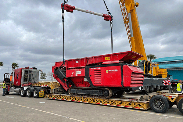 Large truck and trailer getting loaded with freight