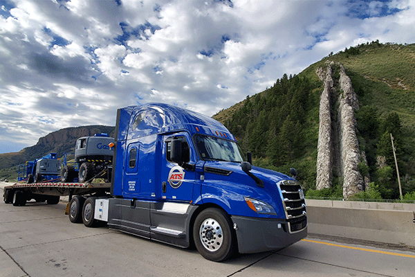 Flatbed trailer parked in the mountains