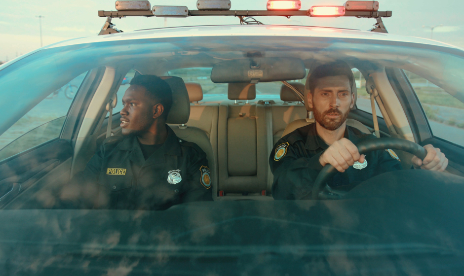 Two police officers in a patrol car