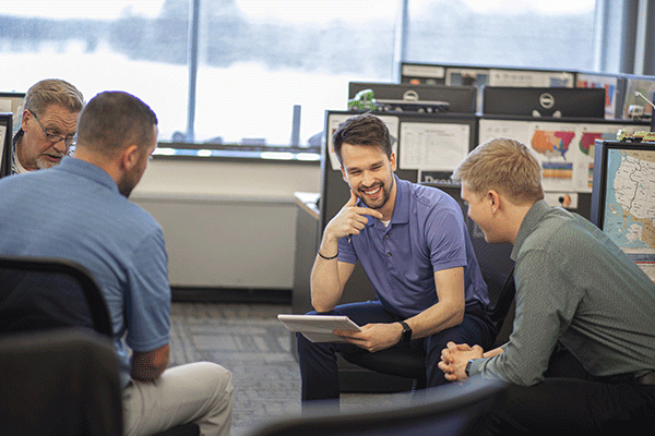 four-logistics-sales-reps-strategizing