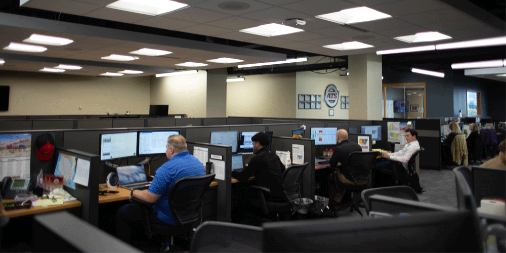 Employees in cubicles.